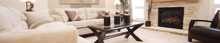 A bright living room with light upholstery and carpet